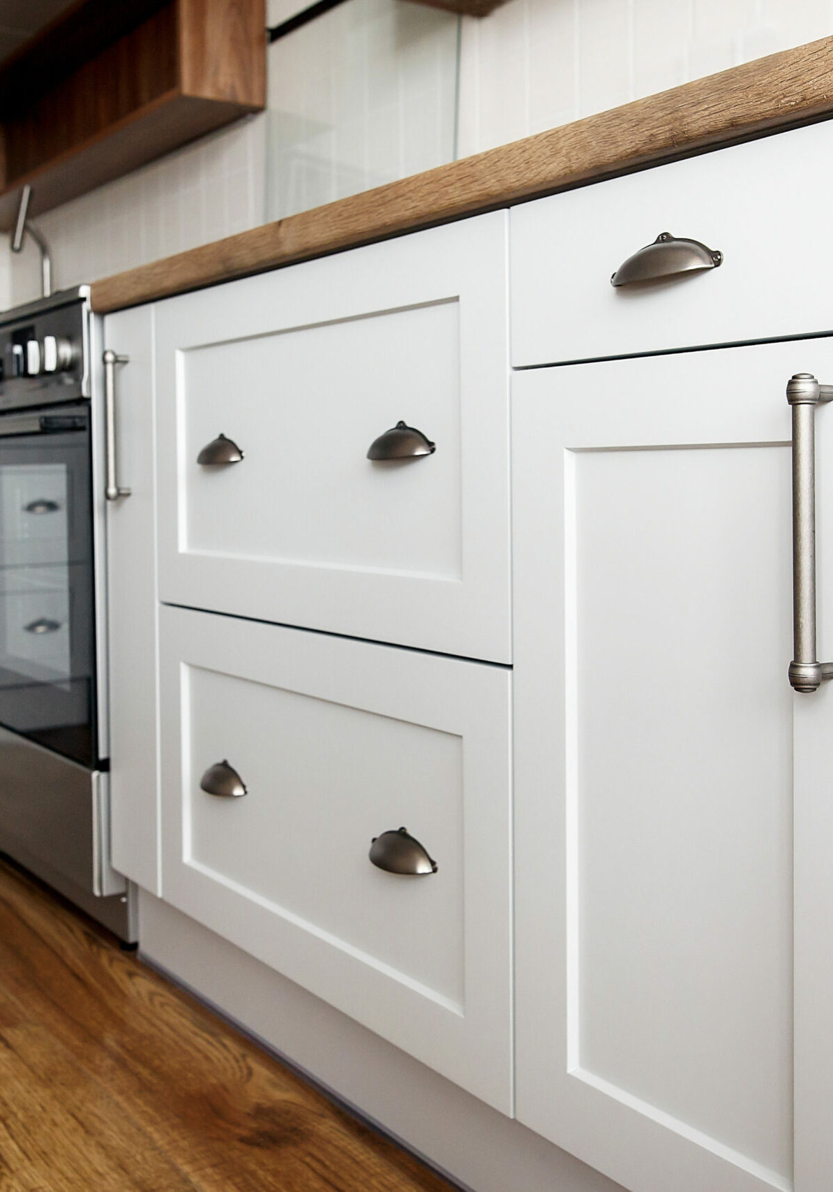 Stylish light gray handles on cabinets | Floor to Ceiling Willmar