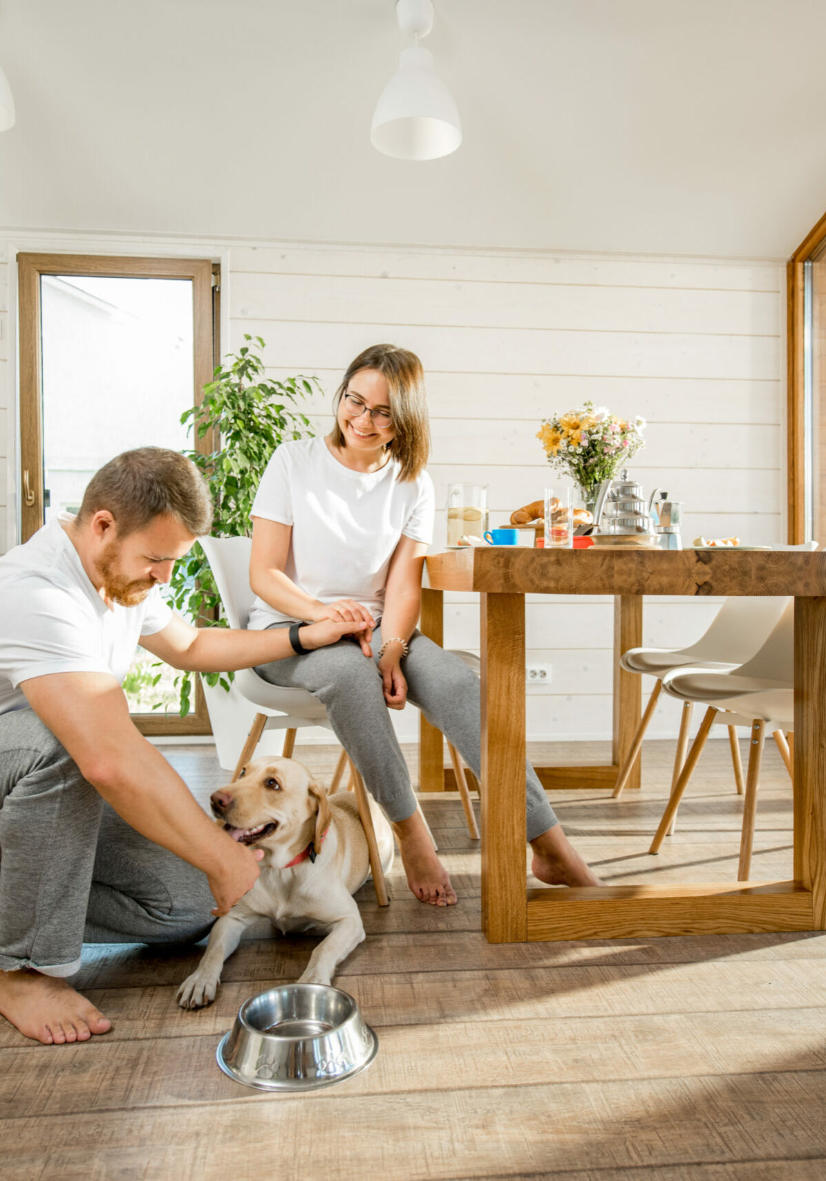Young couple with dog at home | Floor to Ceiling Willmar