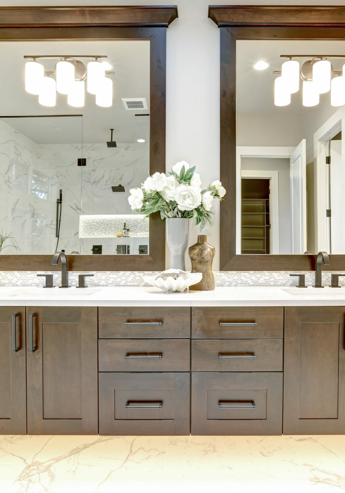 Master bathroom interior in luxury modern home with dark hardwood cabinets, white tub and glass door shower Master bathroom interior | Floor to Ceiling Willmar